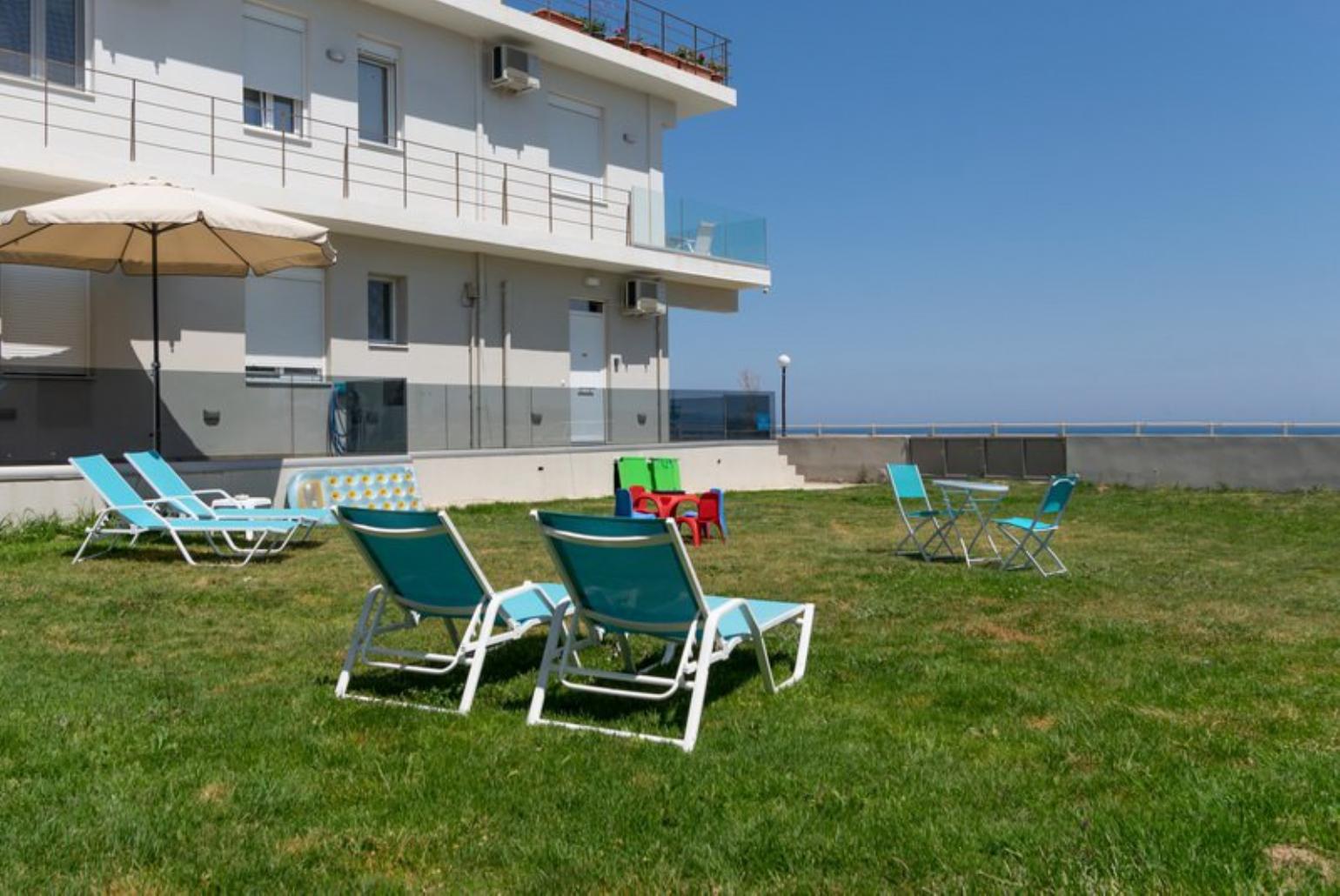 Outdoor area with sunbeds and playground