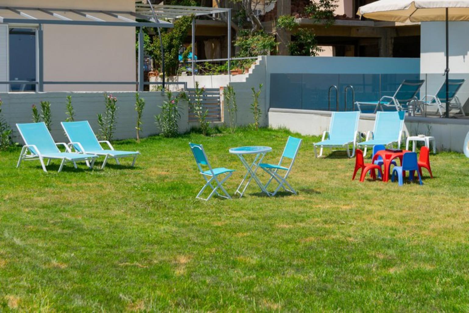 Outdoor area with sunbeds and playground