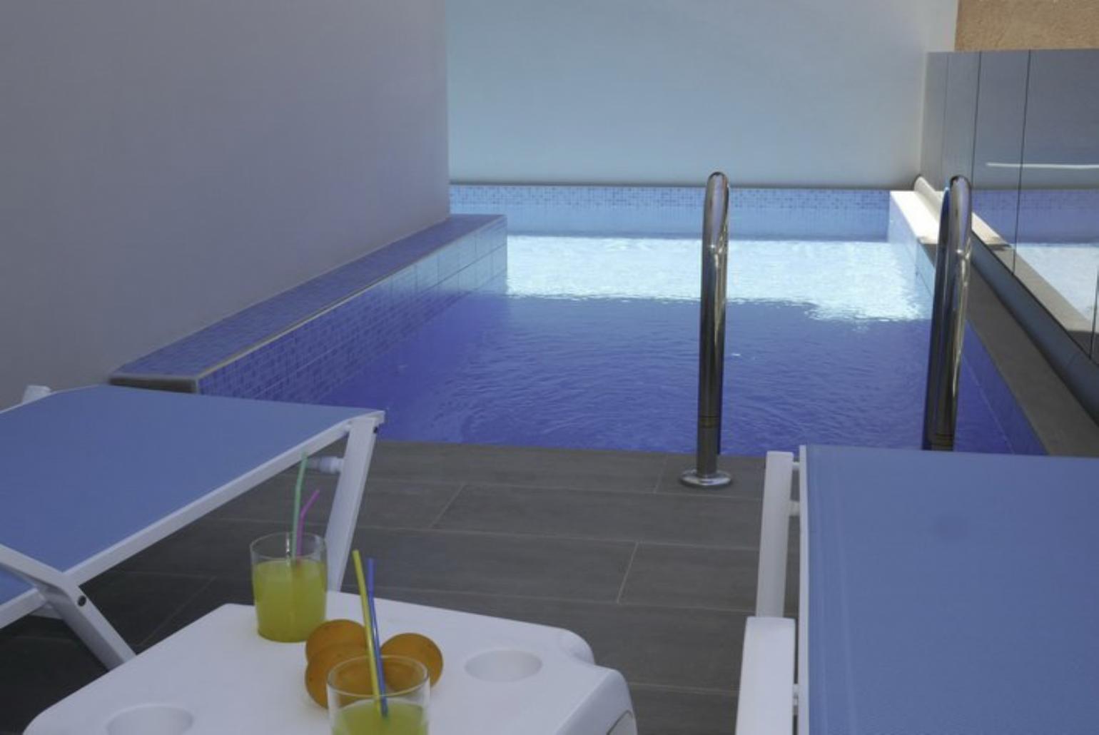 Pool area with sunbeds