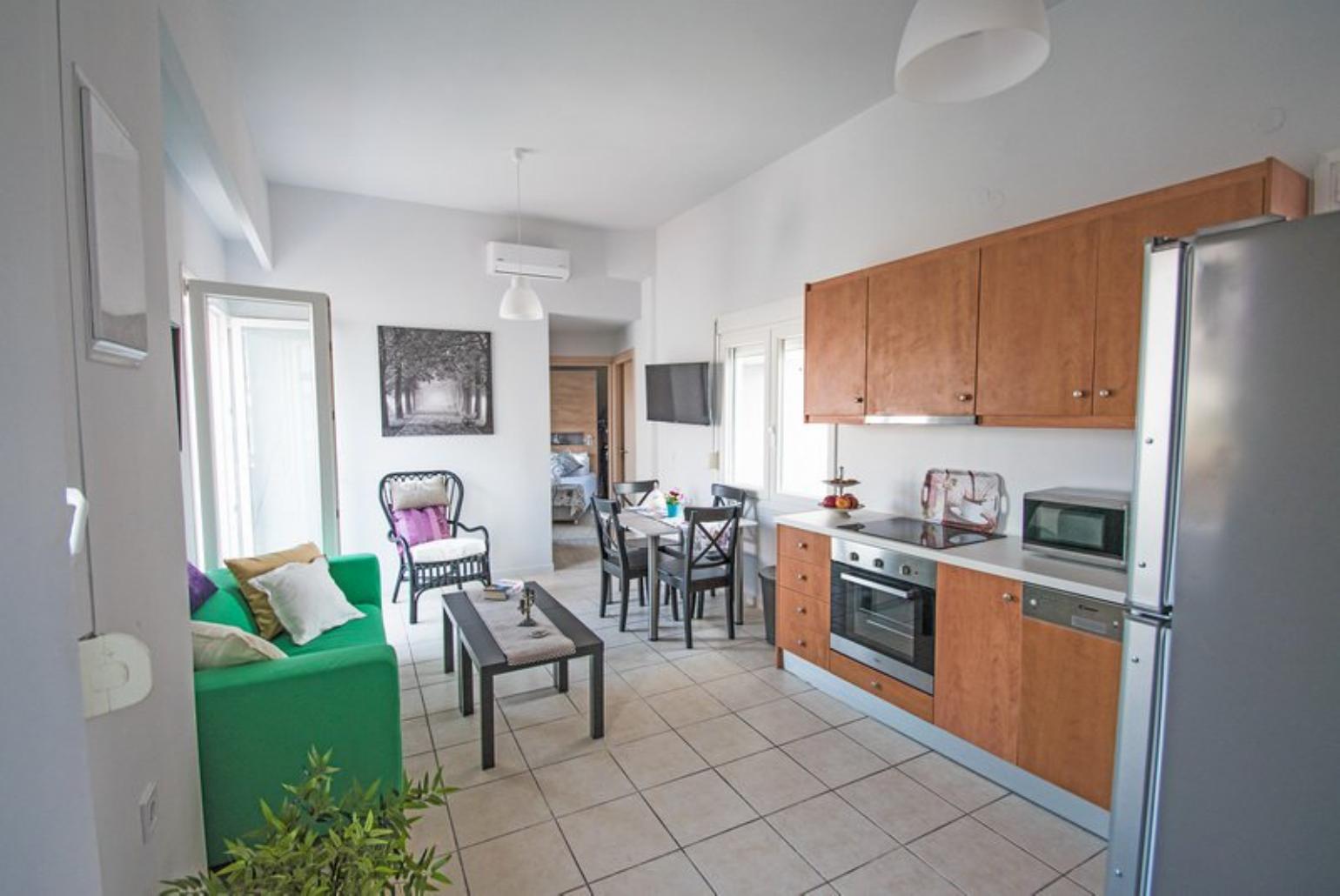 Open-concept living room with kitchen and dining area