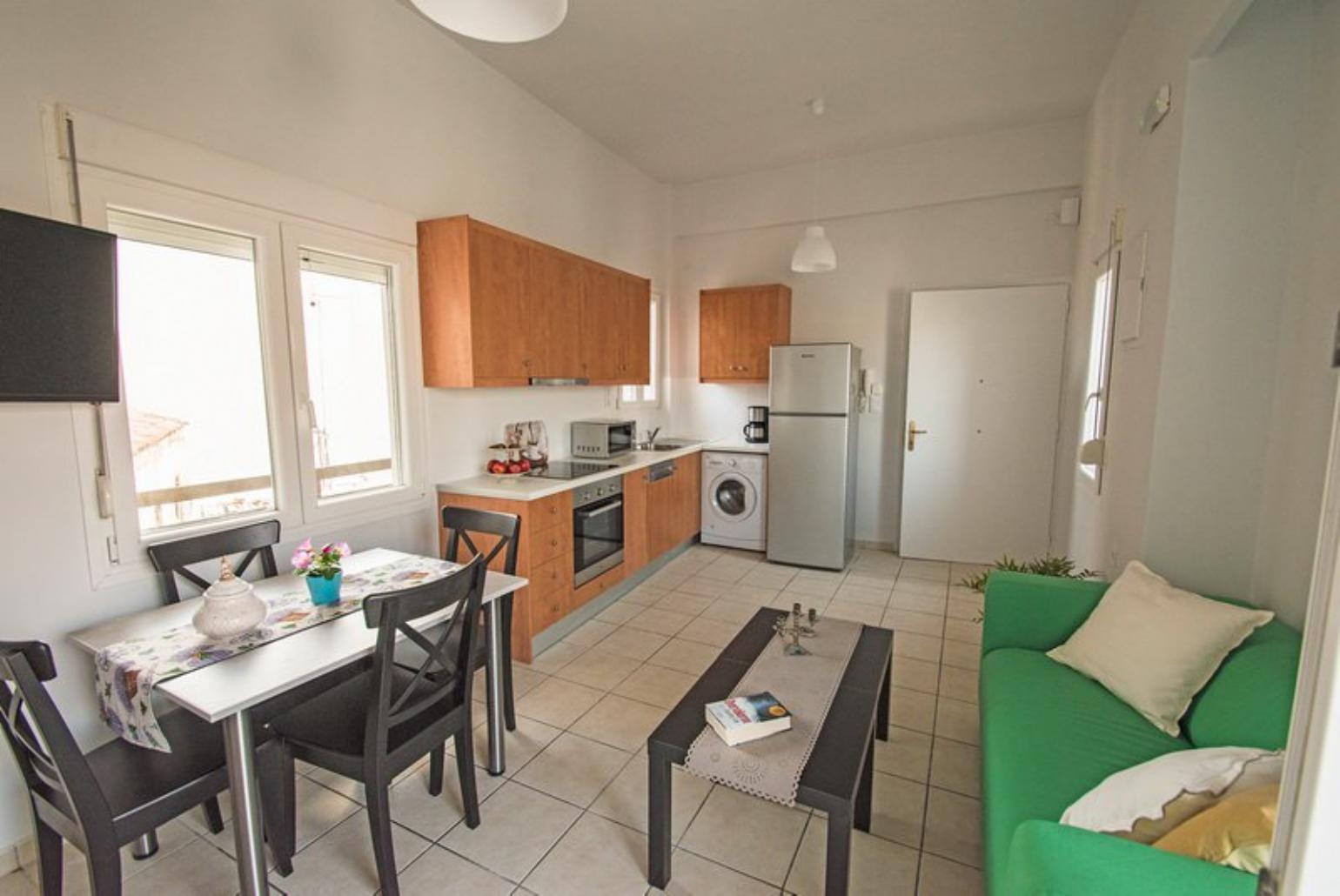 Open-concept living room with kitchen and dining area