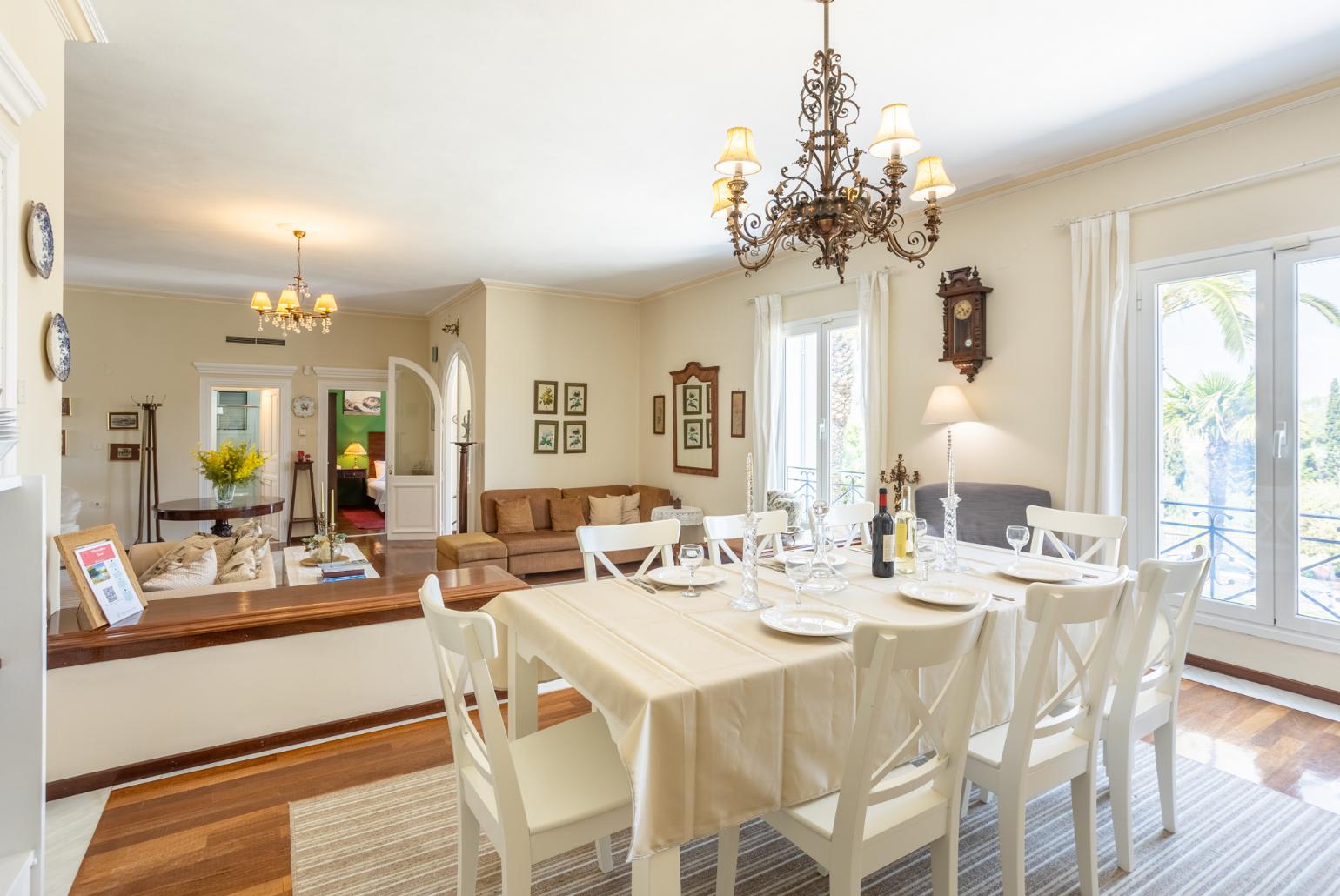 Living room with sofas, dining area, ornamental fireplace, WiFi internet, and satellite TV