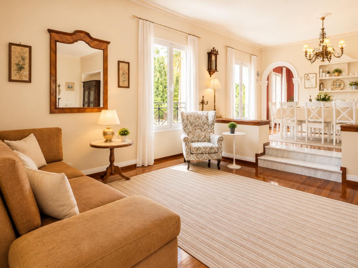 Living room with sofas, dining area, ornamental fireplace, WiFi internet, and satellite TV