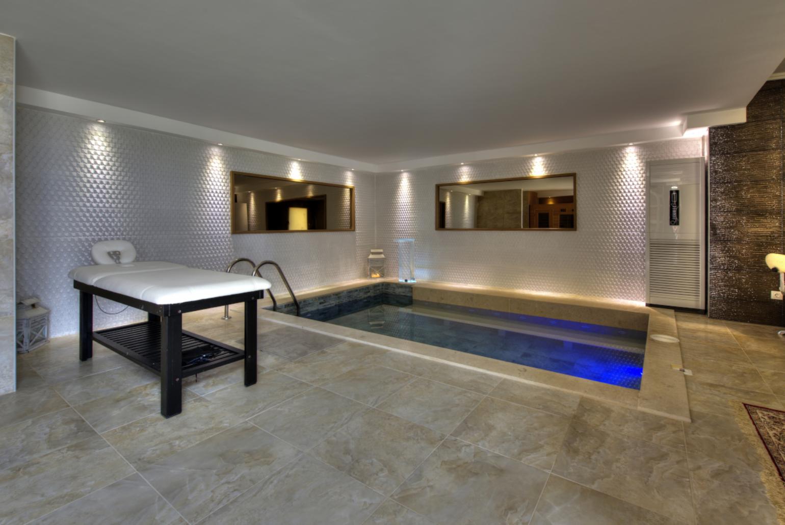 Spa area with massage table and pool