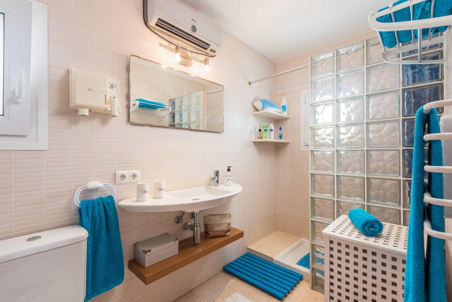 Bathroom with bath and overhead shower