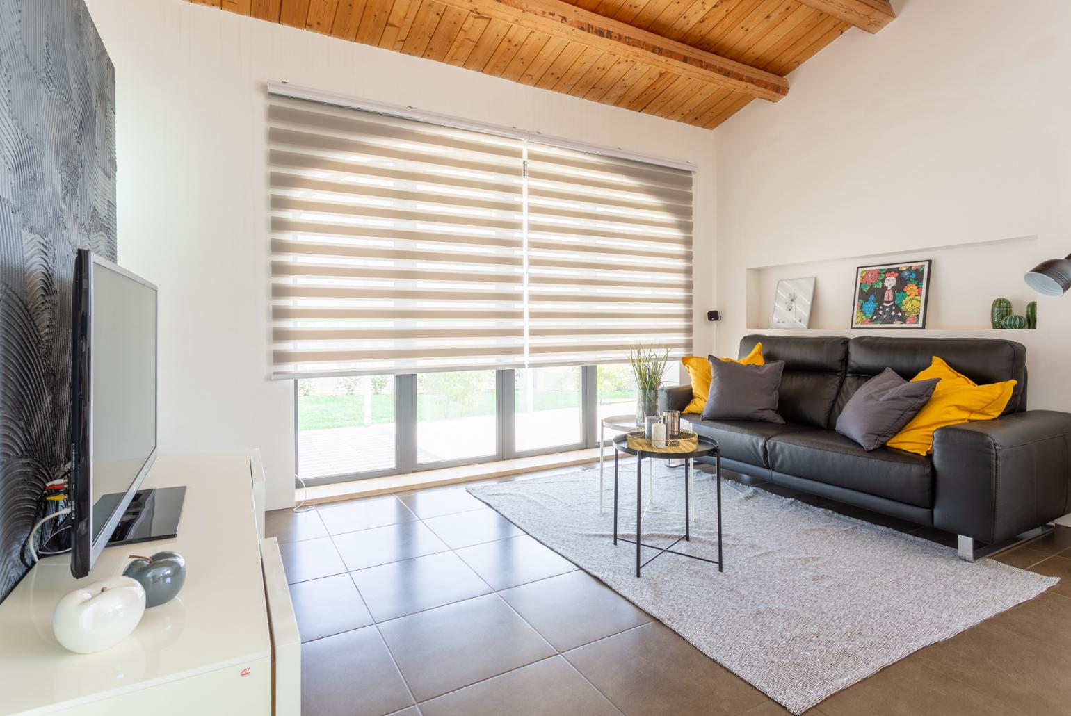 Living room with sofa, dining area, ornamental fireplace, A/C, WiFi internet, satellite TV, and terrace access