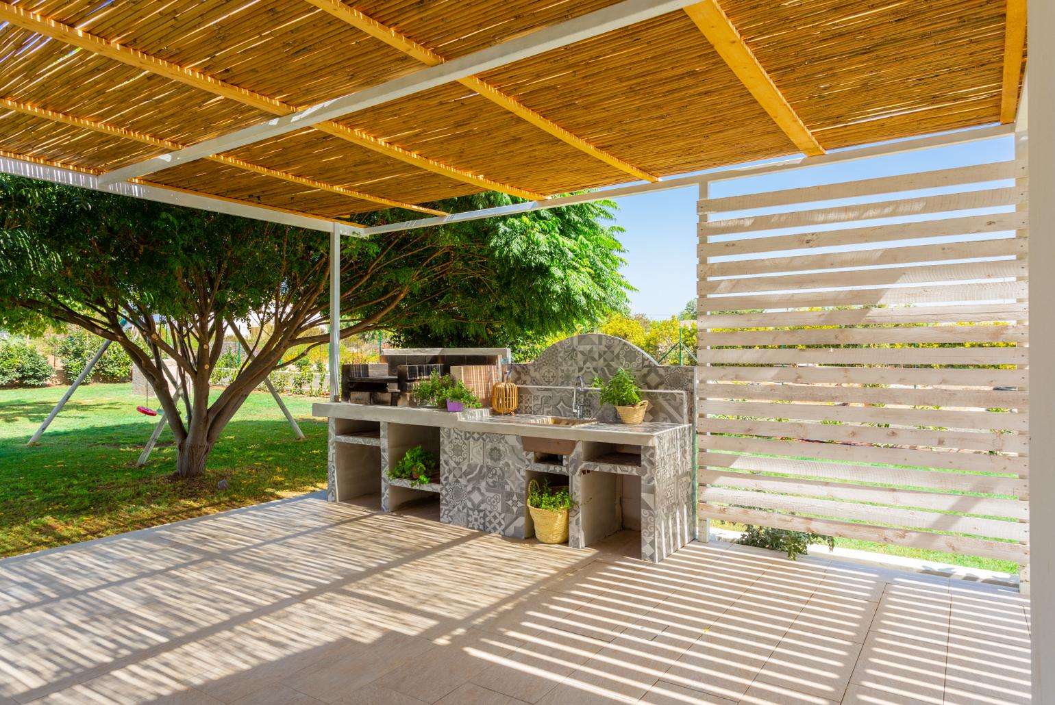 Sheltered terrace area with BBQ