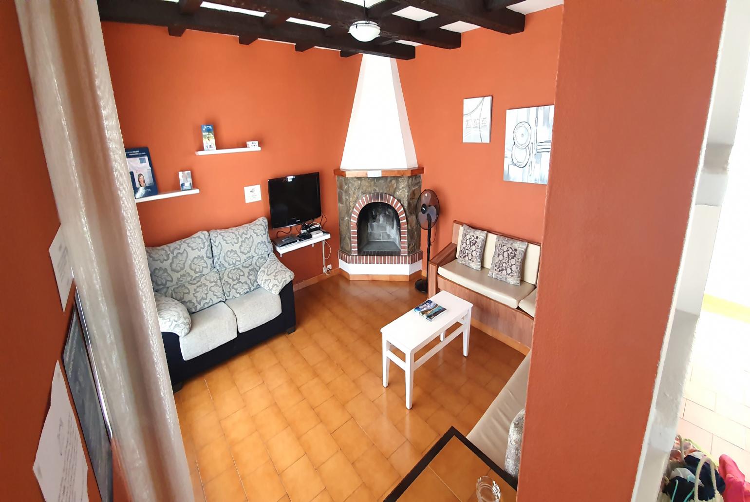 Open plan living room with WiFi Internet, Satellite TV, and Ornamental Fireplace