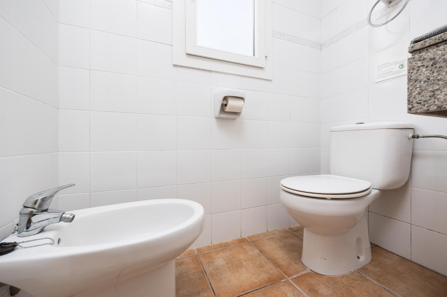 En suite bathroom with bath and shower