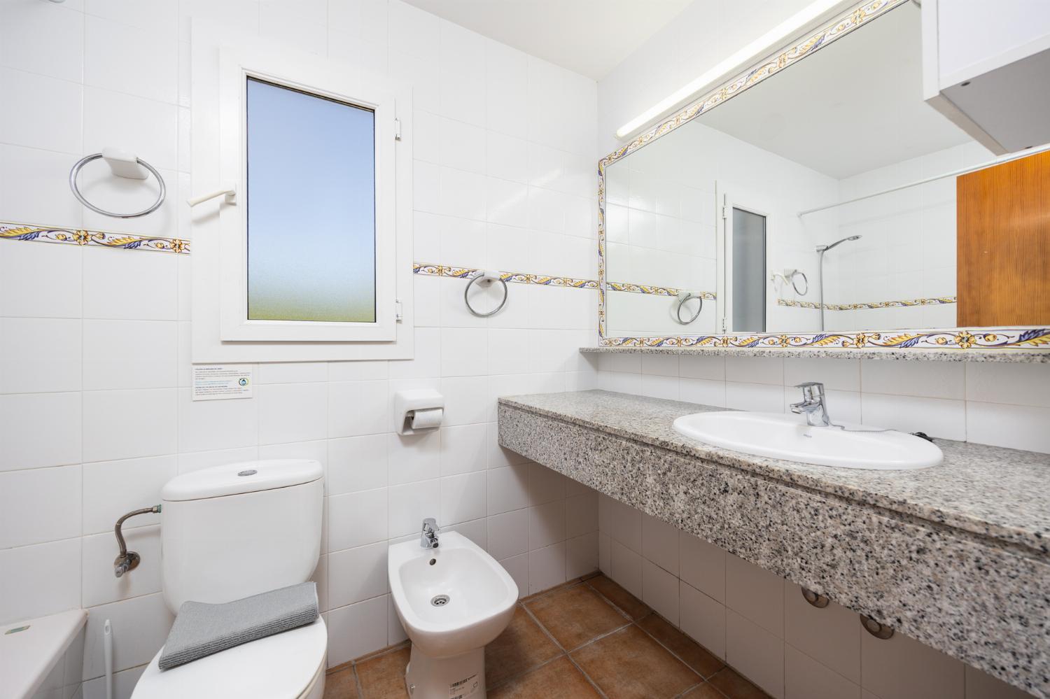 Family bathroom with bath and shower