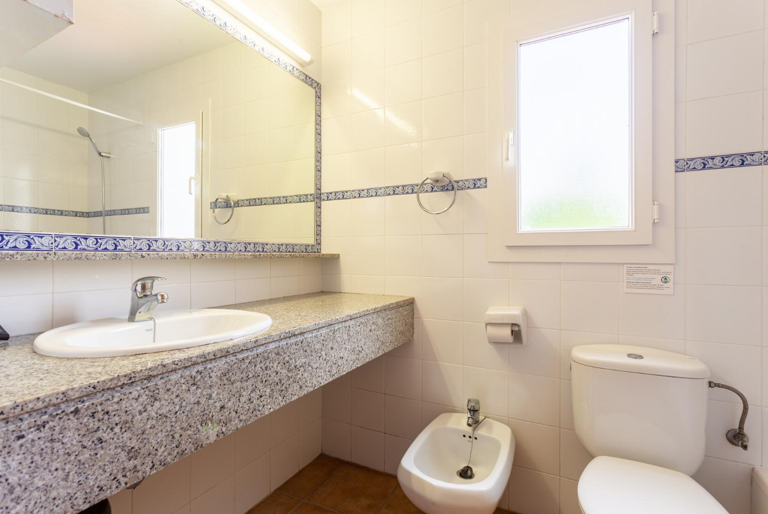 Family bathroom with bath and shower