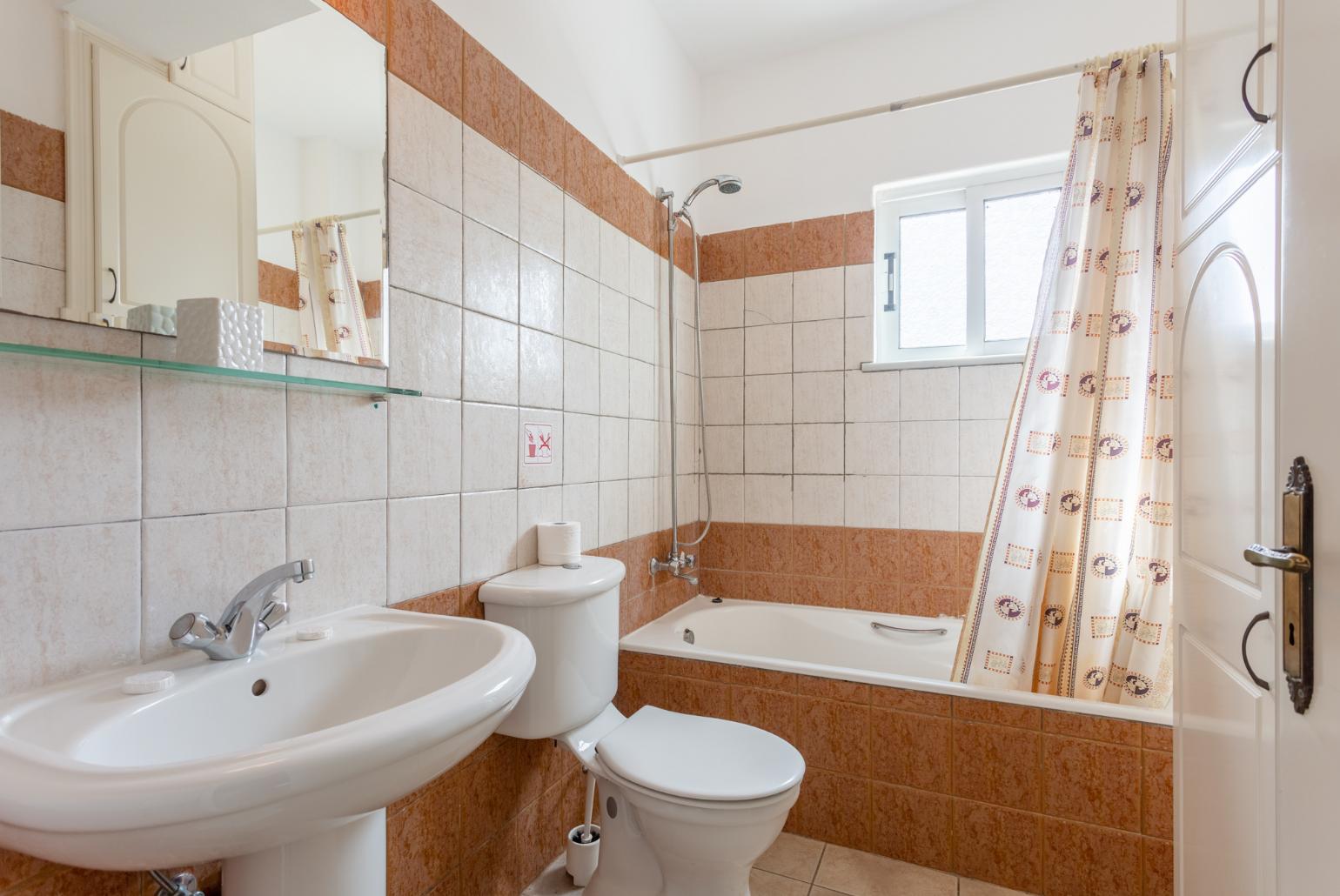 Family bathroom with bath and shower