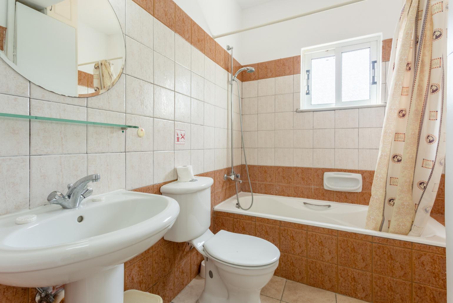 Family bathroom with bath and shower