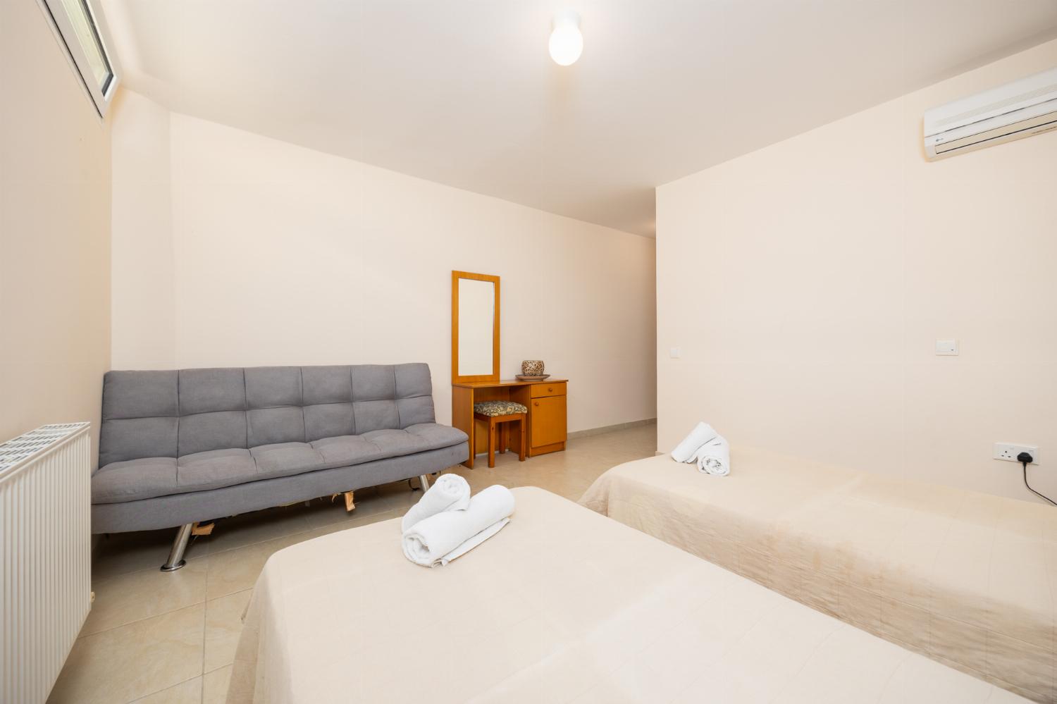 Twin bedroom with en suite bathroom and A/C