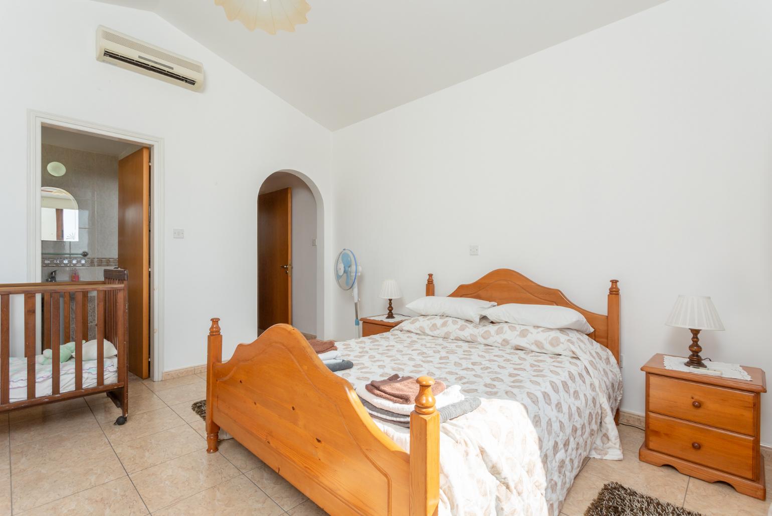 Double bedroom with en suite bathroom, A/C, and upper terrace access with sea views
