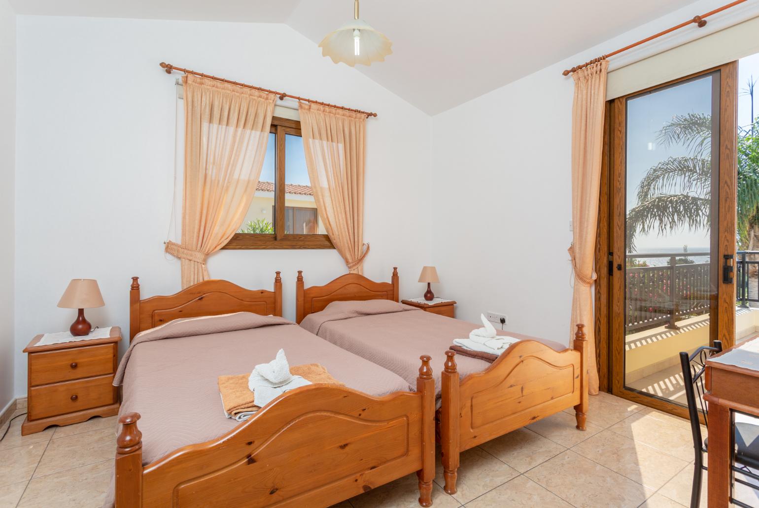 Twin bedroom with en suite bathroom, A/C, and upper terrace access with sea views