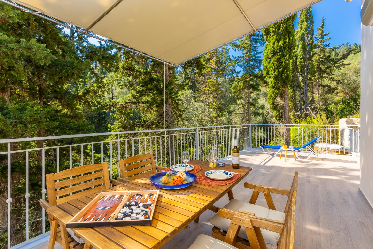 Sheltered terrace area with woodland views