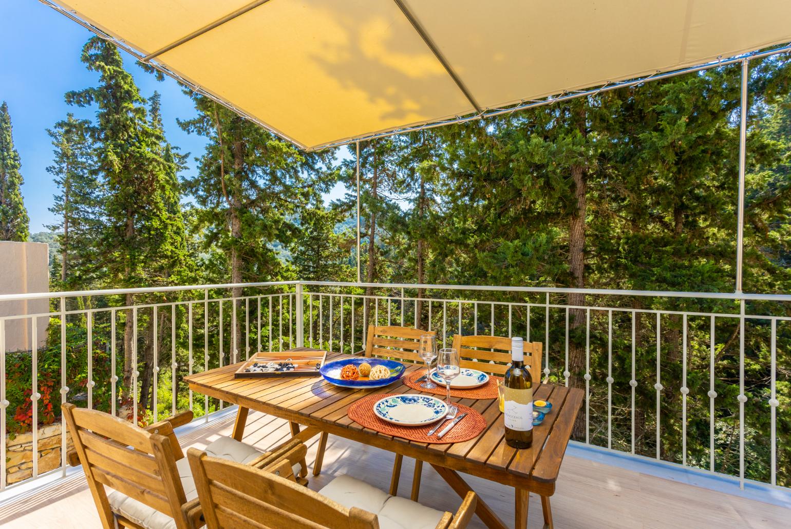 Sheltered terrace area with woodland views