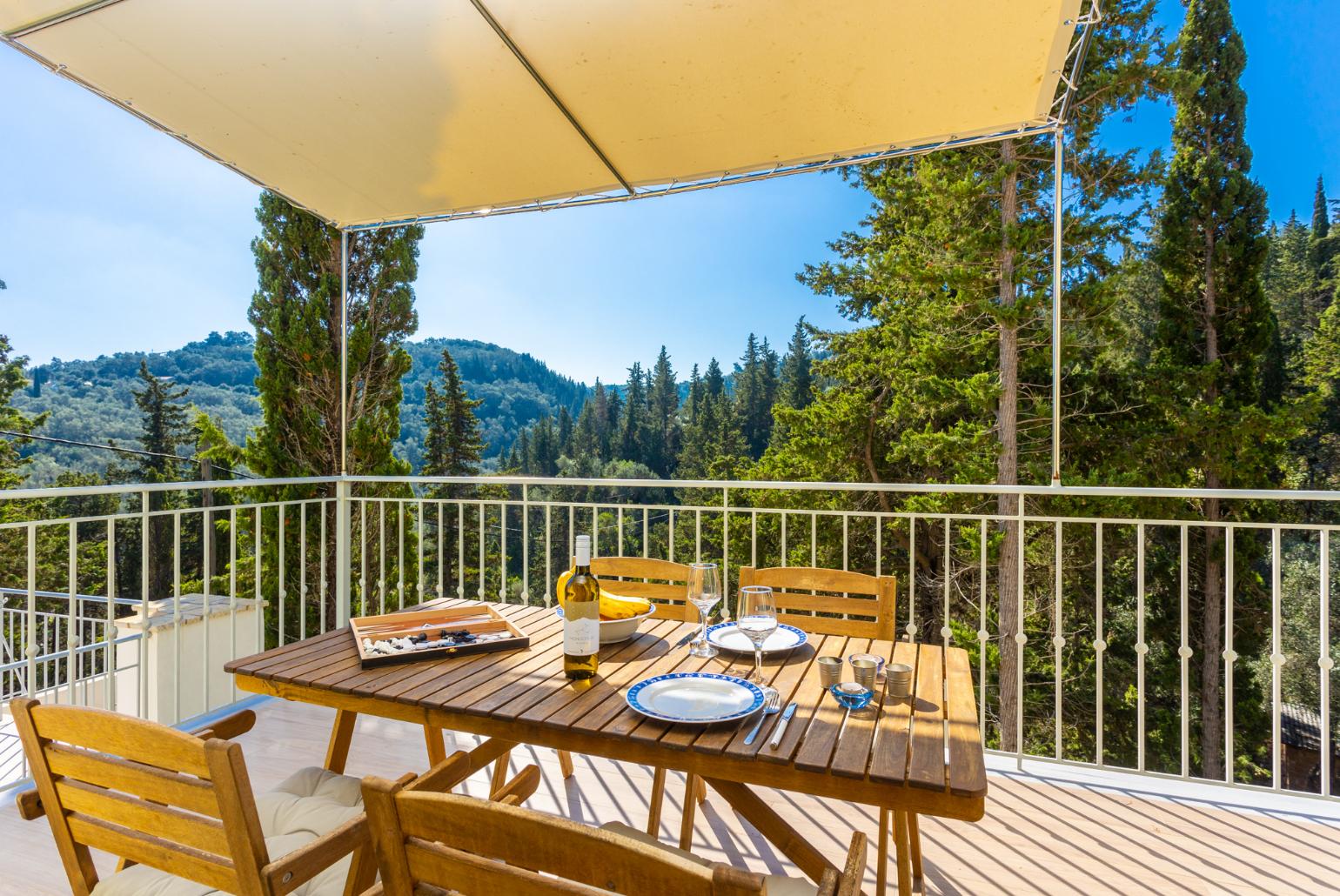 Sheltered terrace area with woodland views