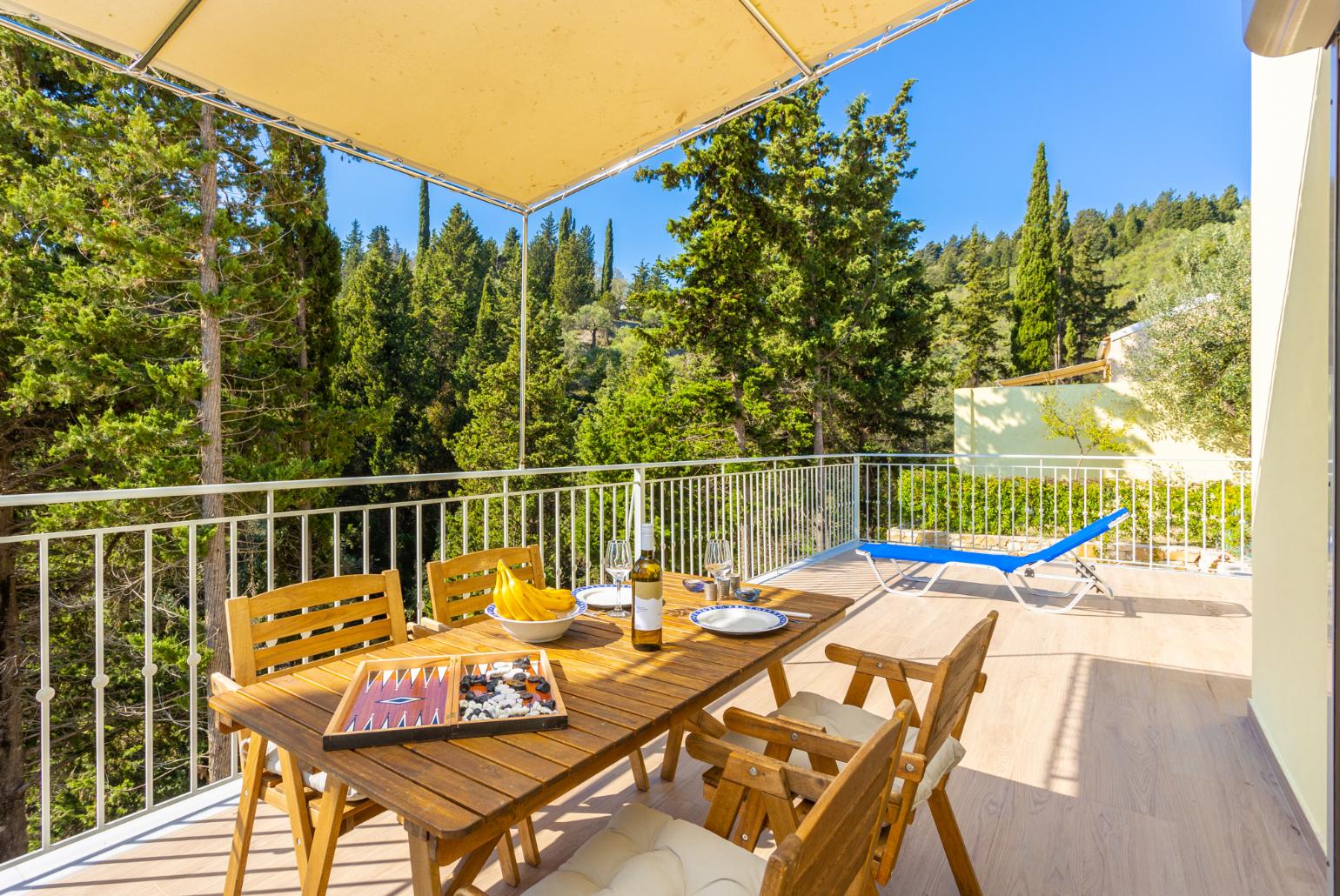 Sheltered terrace area with woodland views