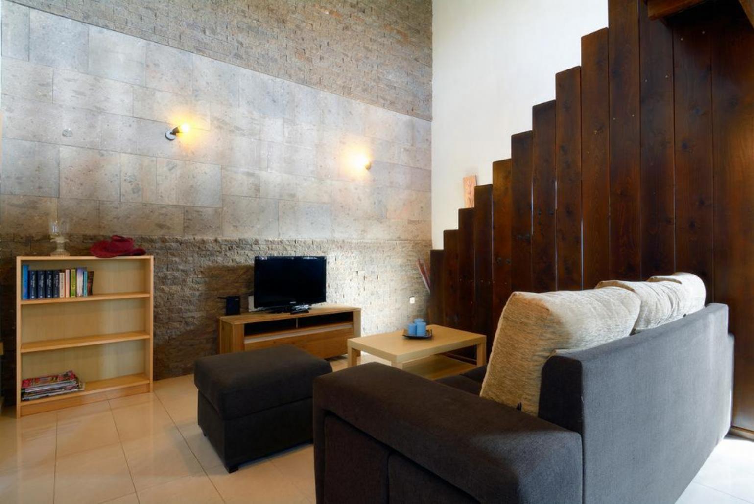 Living room with sofas, dining area, WiFi internet, satellite TV, and DVD player