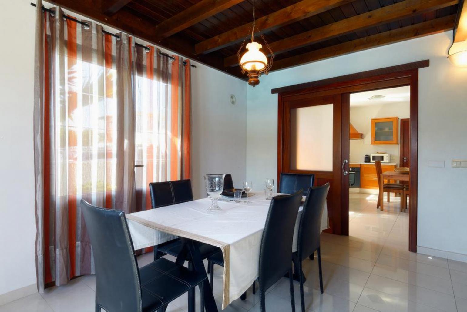 Living room with sofas, dining area, WiFi internet, satellite TV, and DVD player