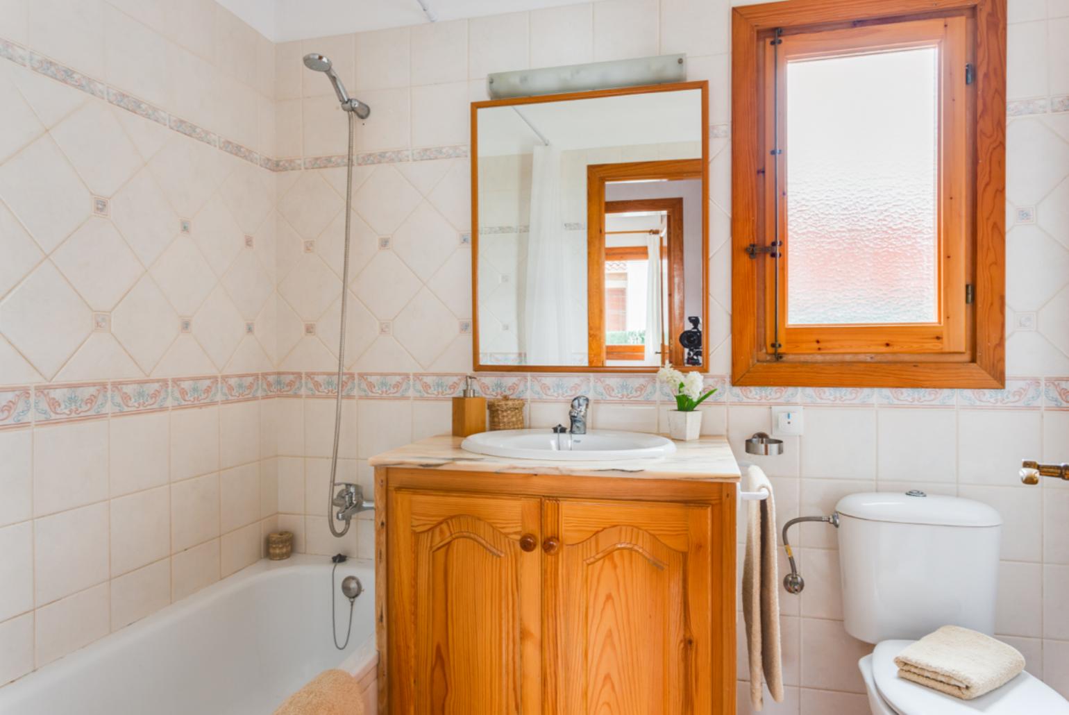 Family bathroom with bath and shower