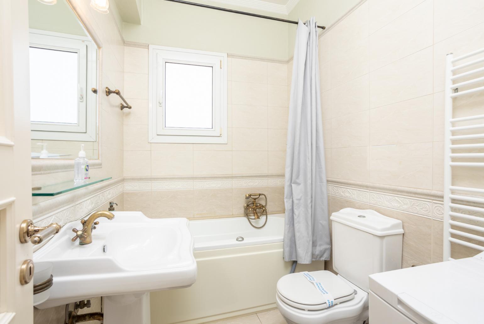 Family bathroom with bath and shower