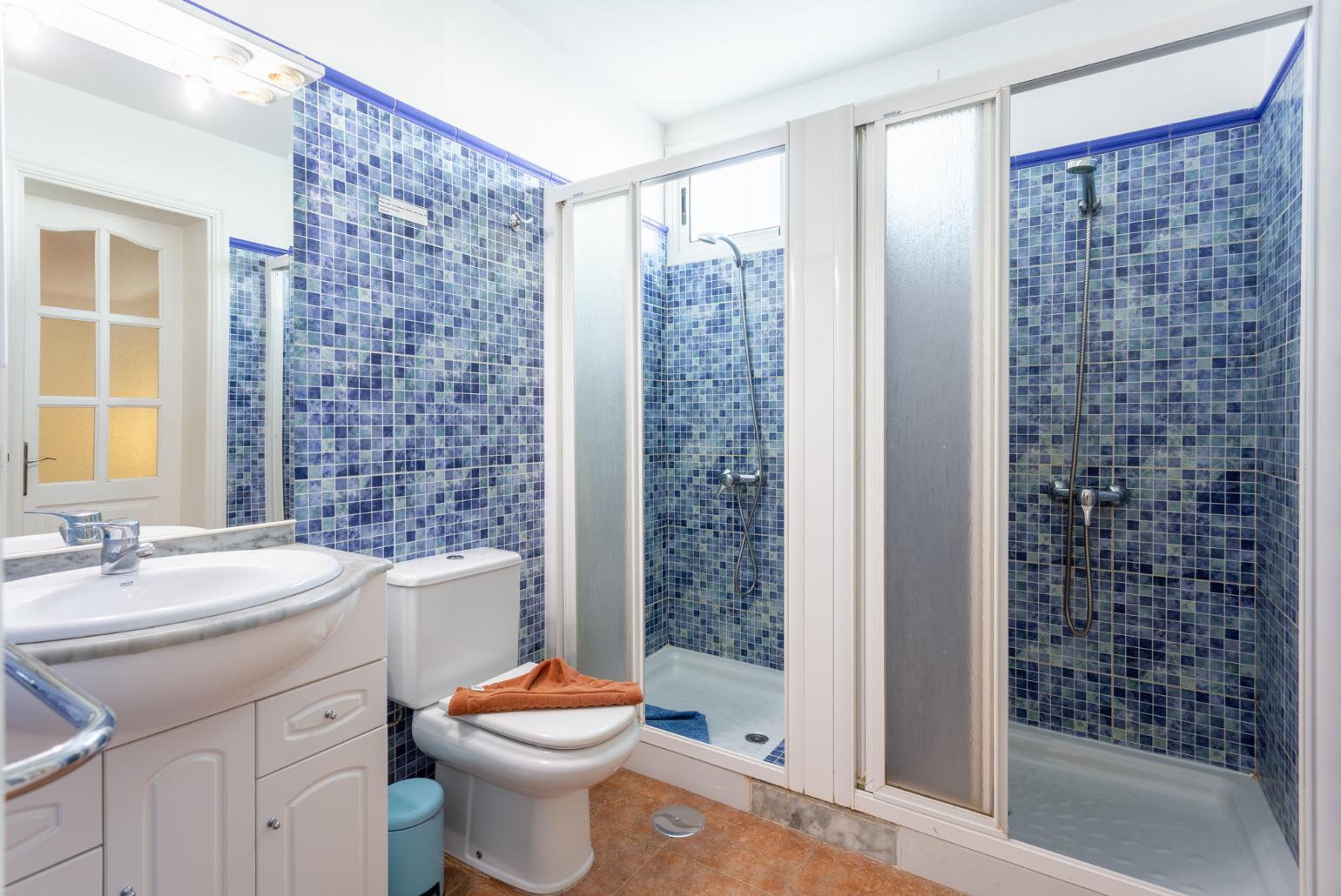 Family bathroom with showers