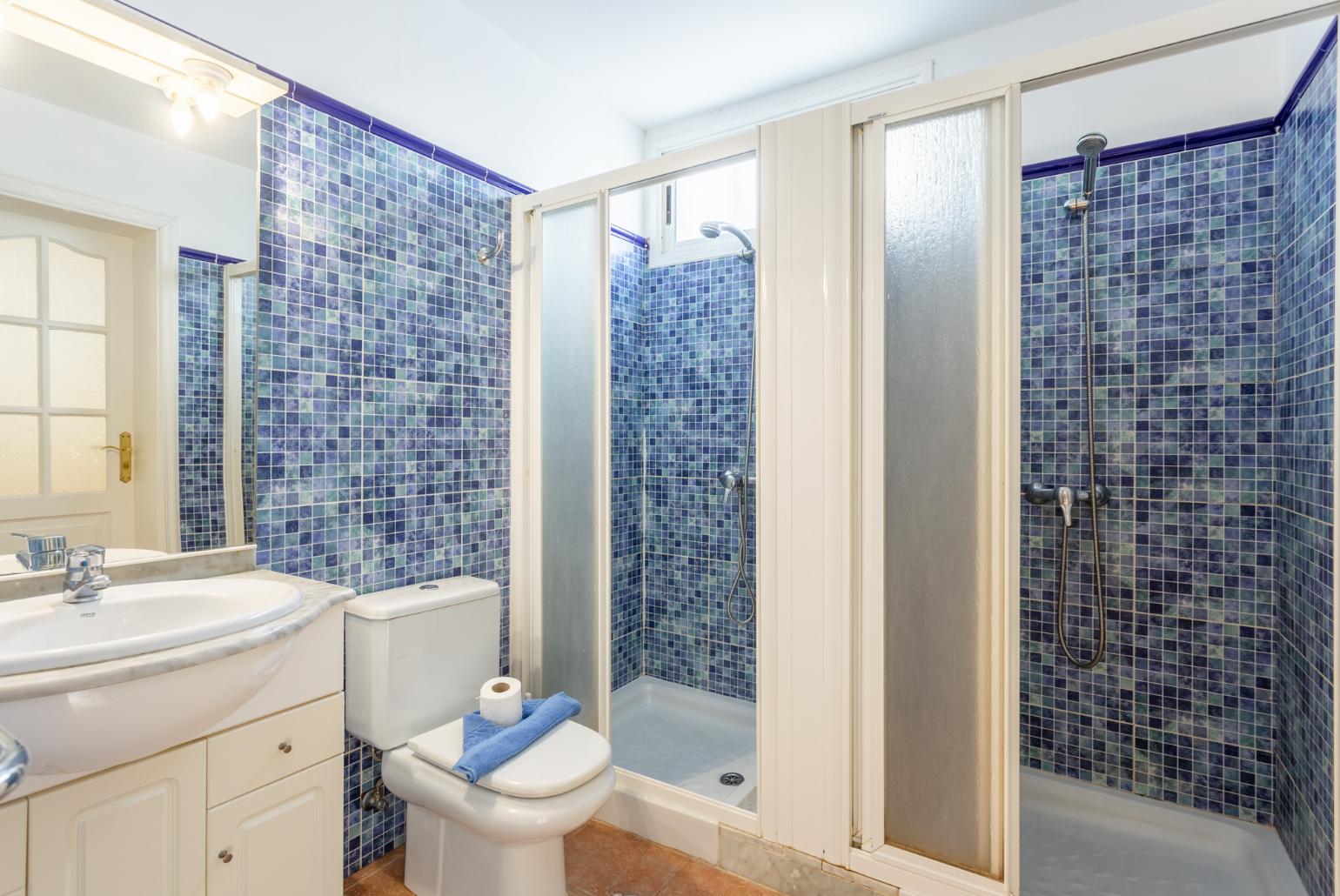 Family bathroom with showers