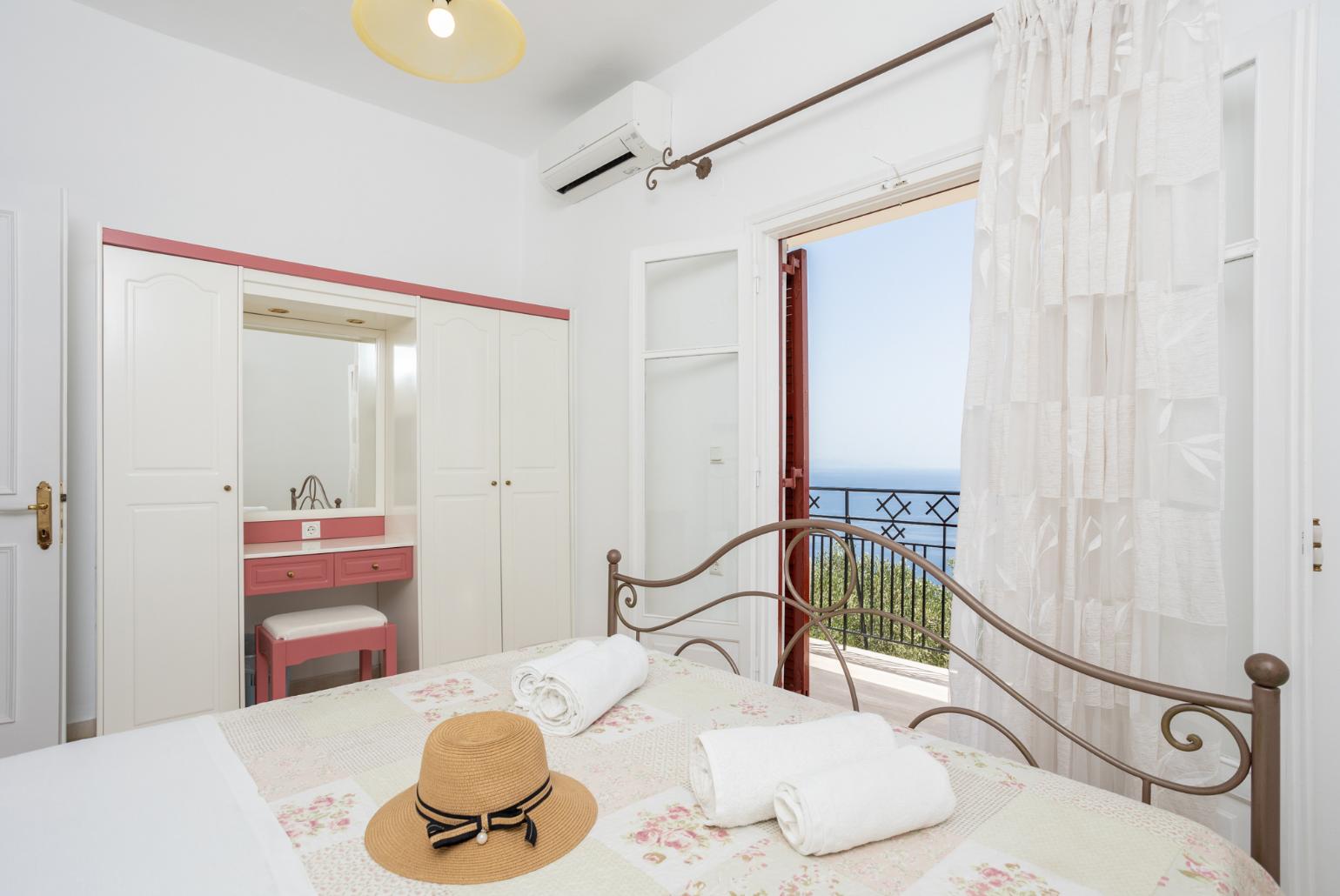 Double bedroom with A/C and balcony access with sea views