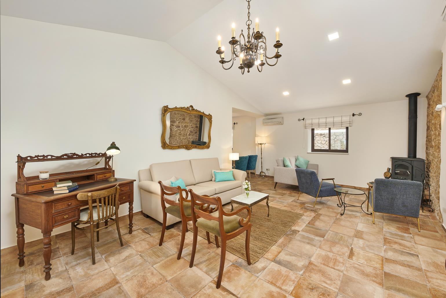 Open-plan living room with sofa, dining area, kitchen, WiFi internet, satellite TV, and sea views