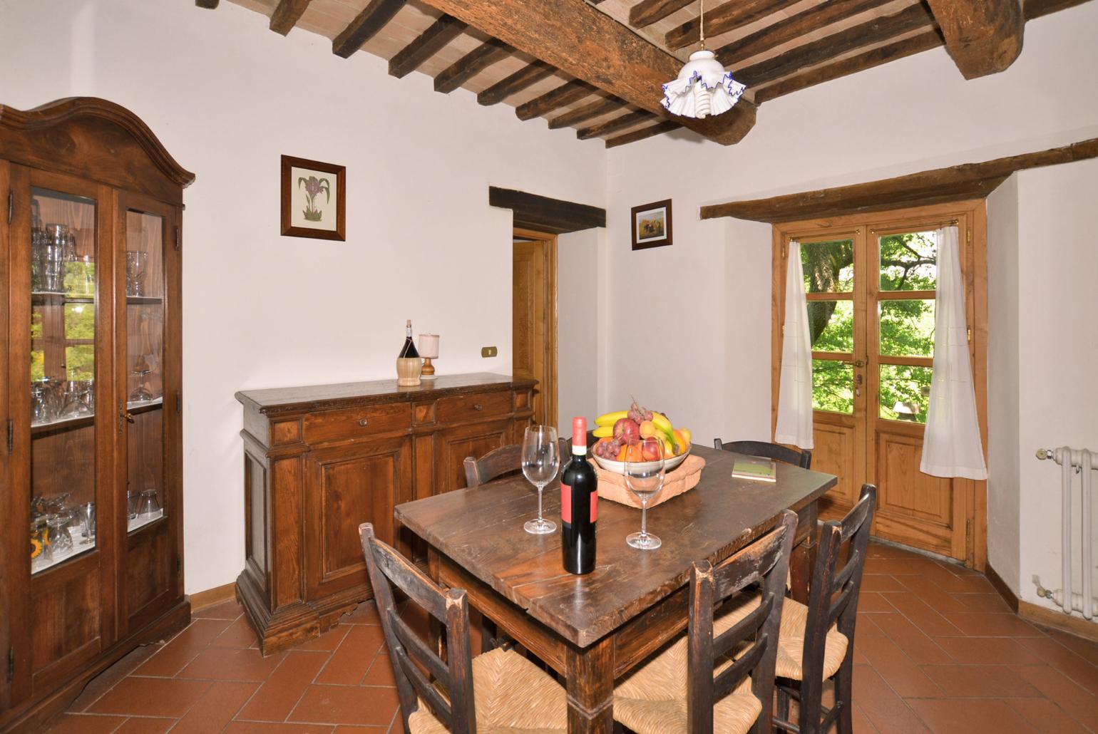 Living room with sofas, dining area, ornamental fireplace, and satellite TV