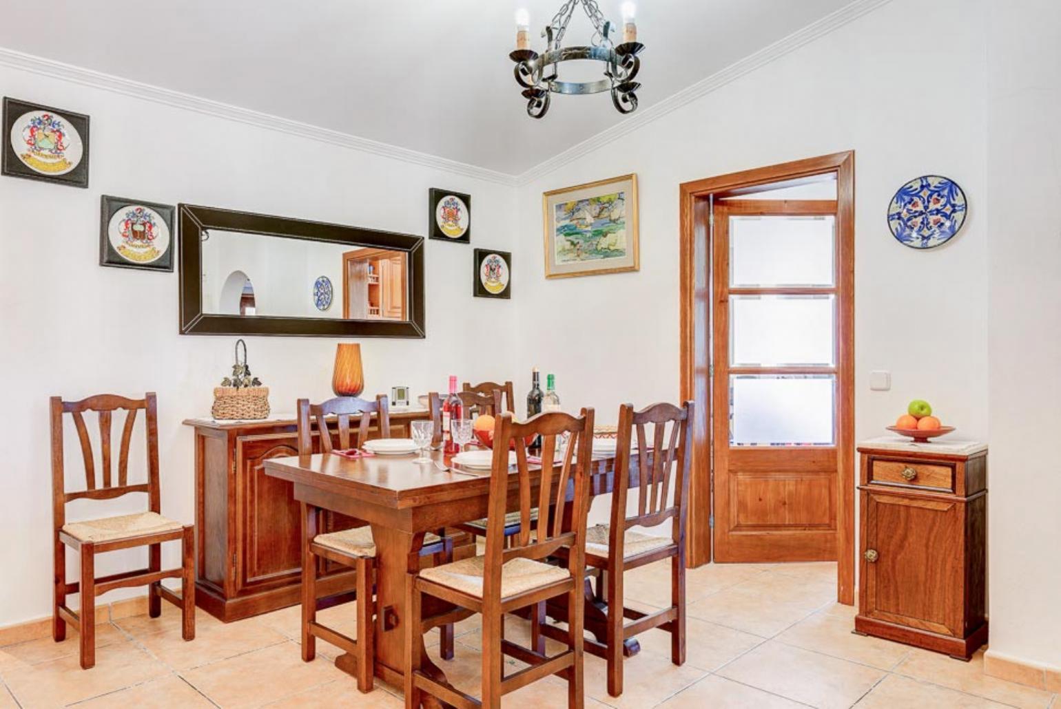 Living room with sofas, dining area, A/C, WiFi internet, and satellite TV