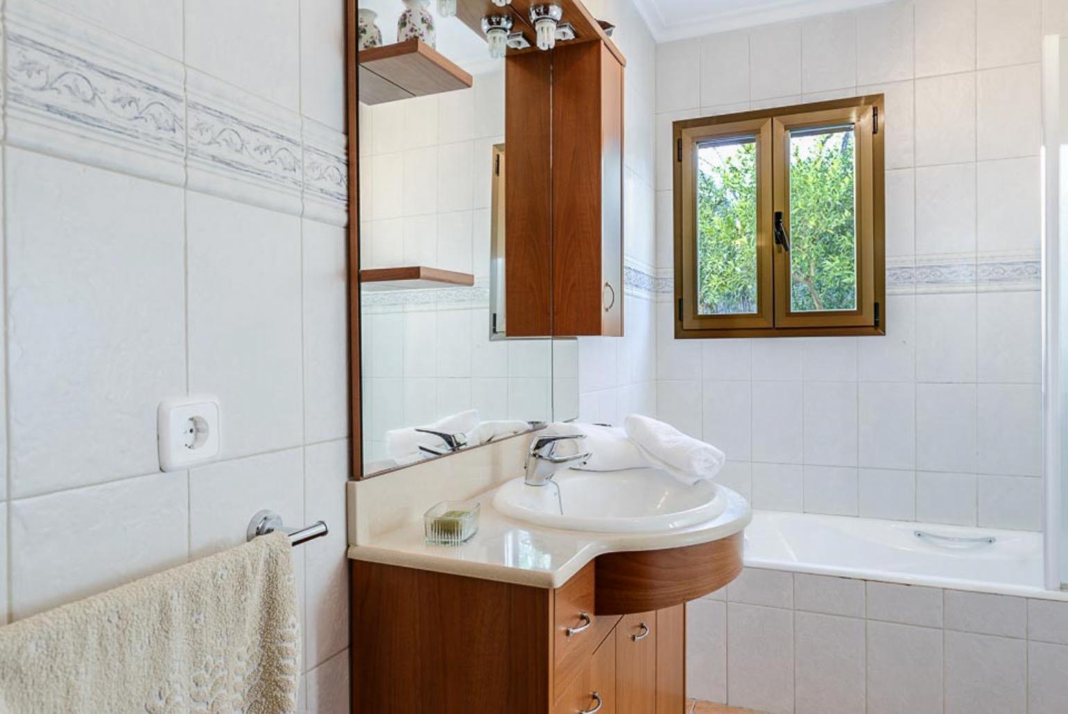 Bathroom with bath and shower