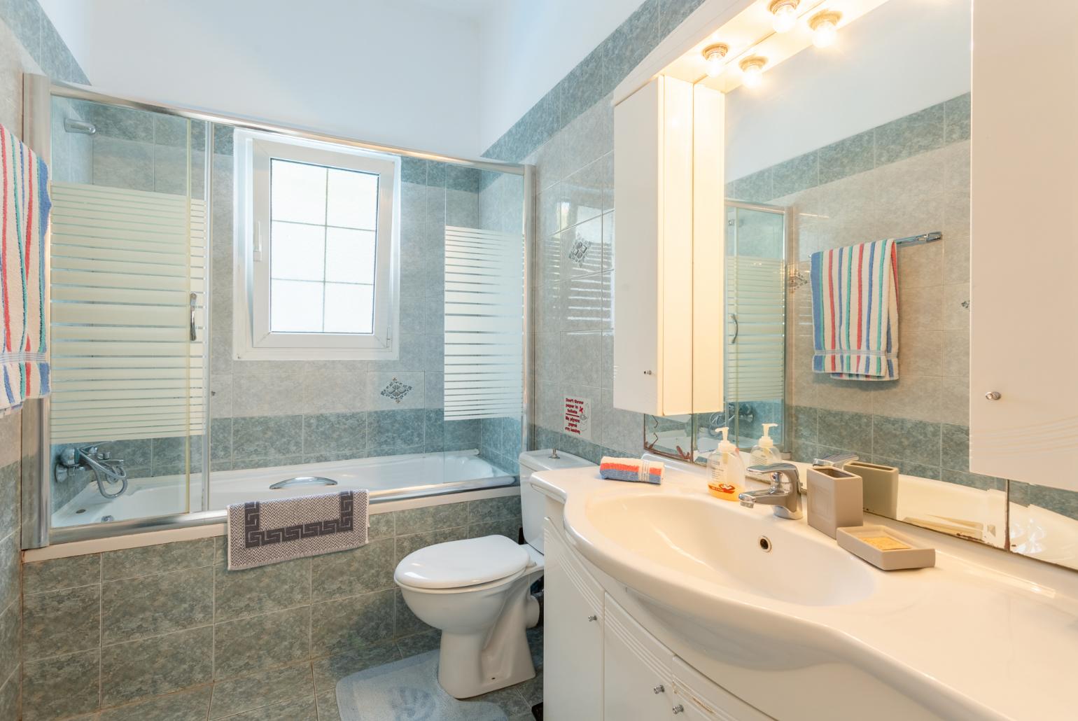 Family bathroom with bath and shower