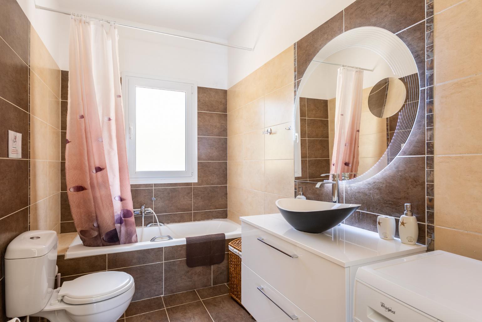 En suite bathroom with bath and shower