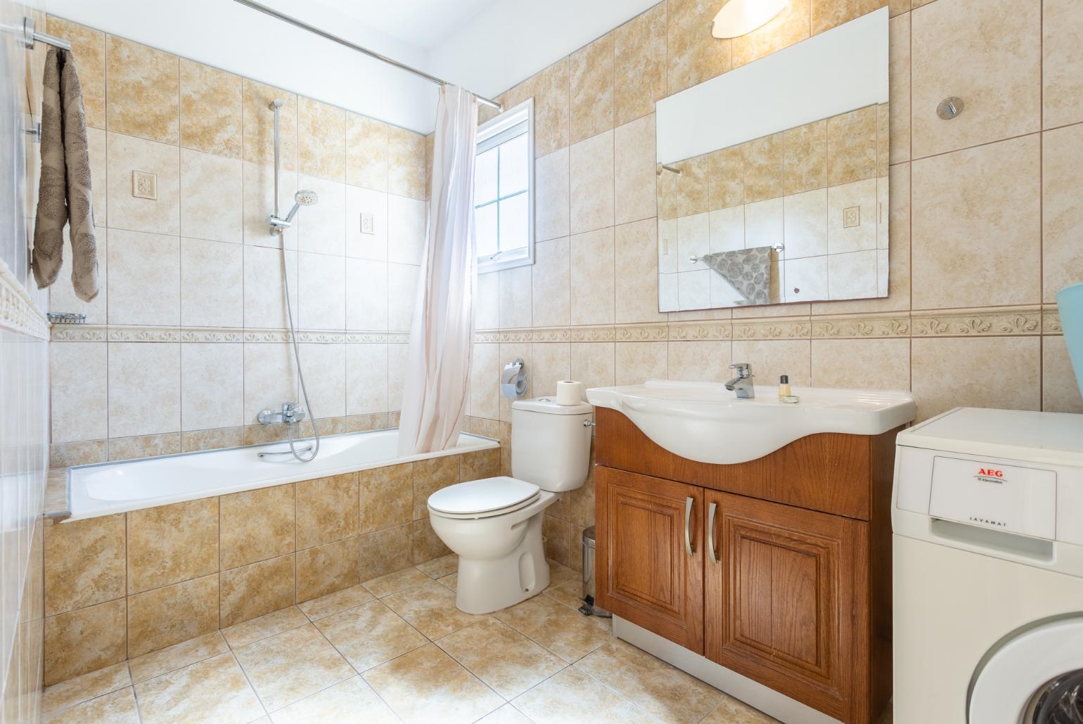 Family bathroom with bath and shower