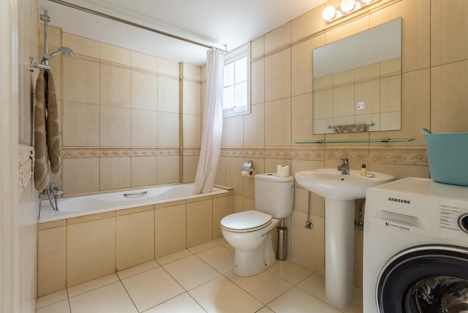 Family bathroom with bath and shower