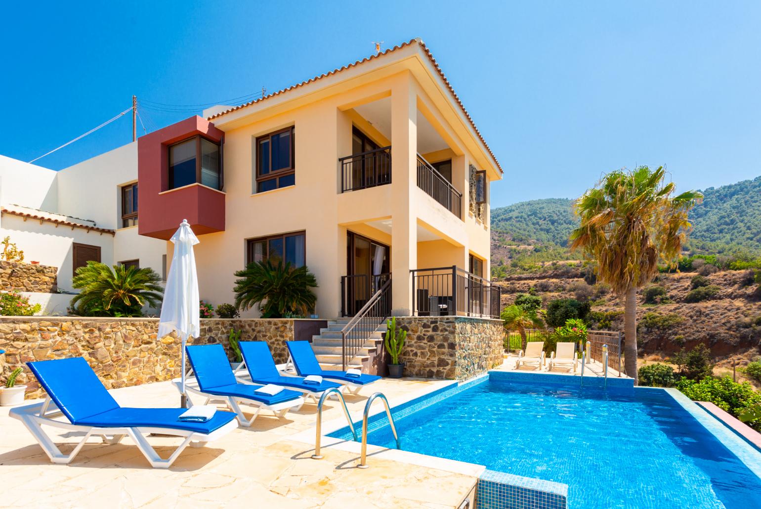 ,Beautiful villa with private infinity pool, terraces, and garden