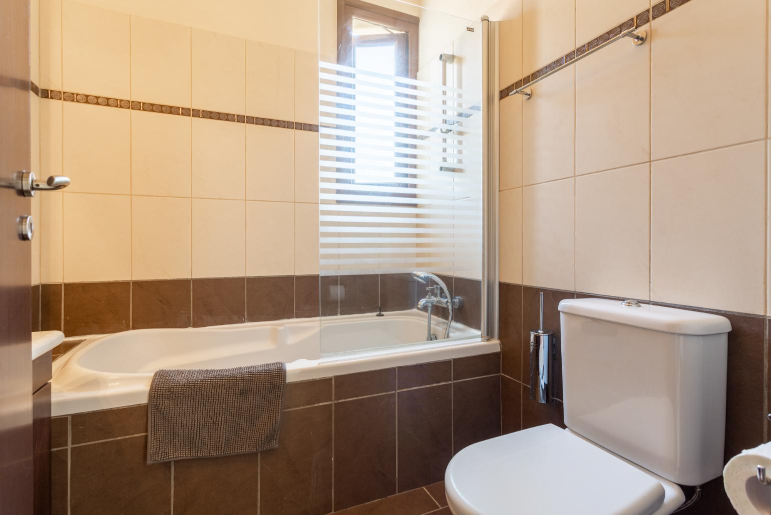 Family bathroom with bath and shower