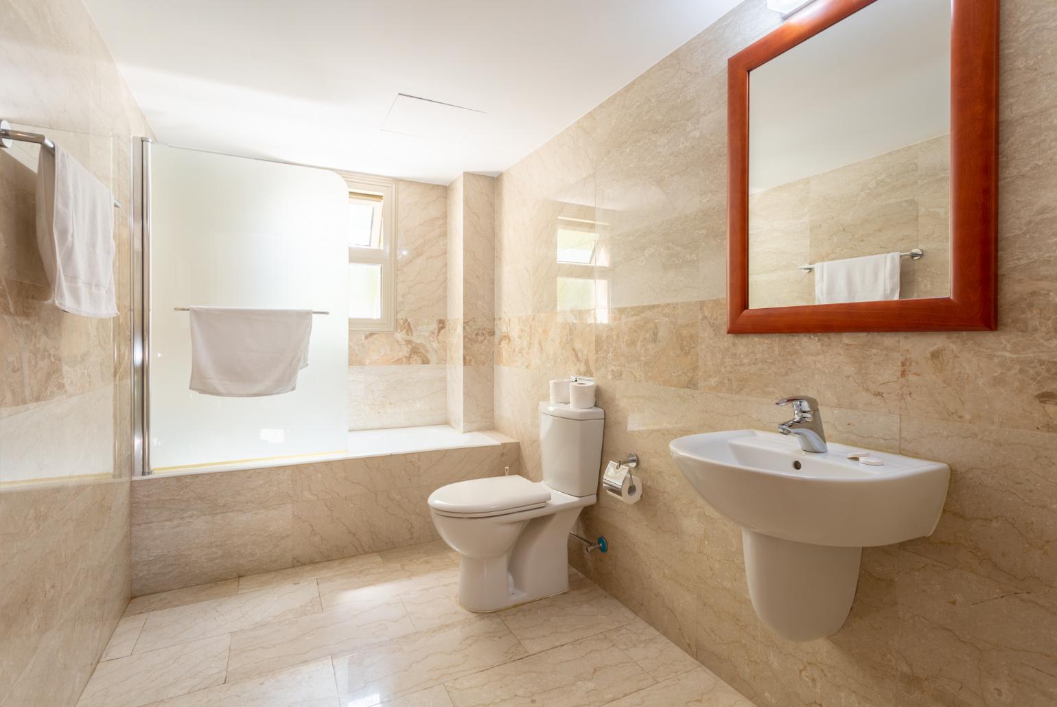 Family bathroom with bath and shower