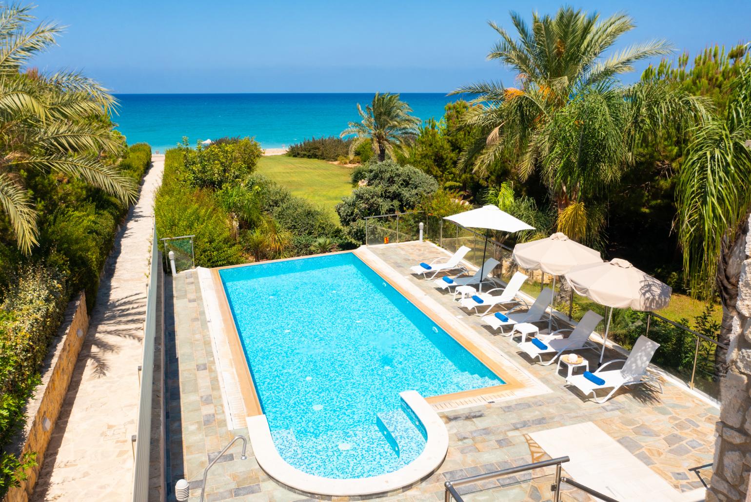 ,Private infinity pool, terrace, and garden with sea views