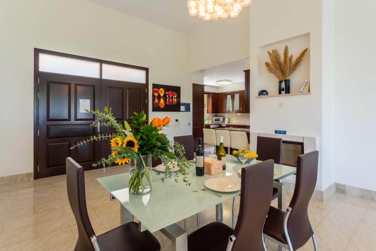 Open-plan living room with sofas, dining area, kitchen, ornamental fireplace, A/C, WiFi internet, satellite TV, and sea views