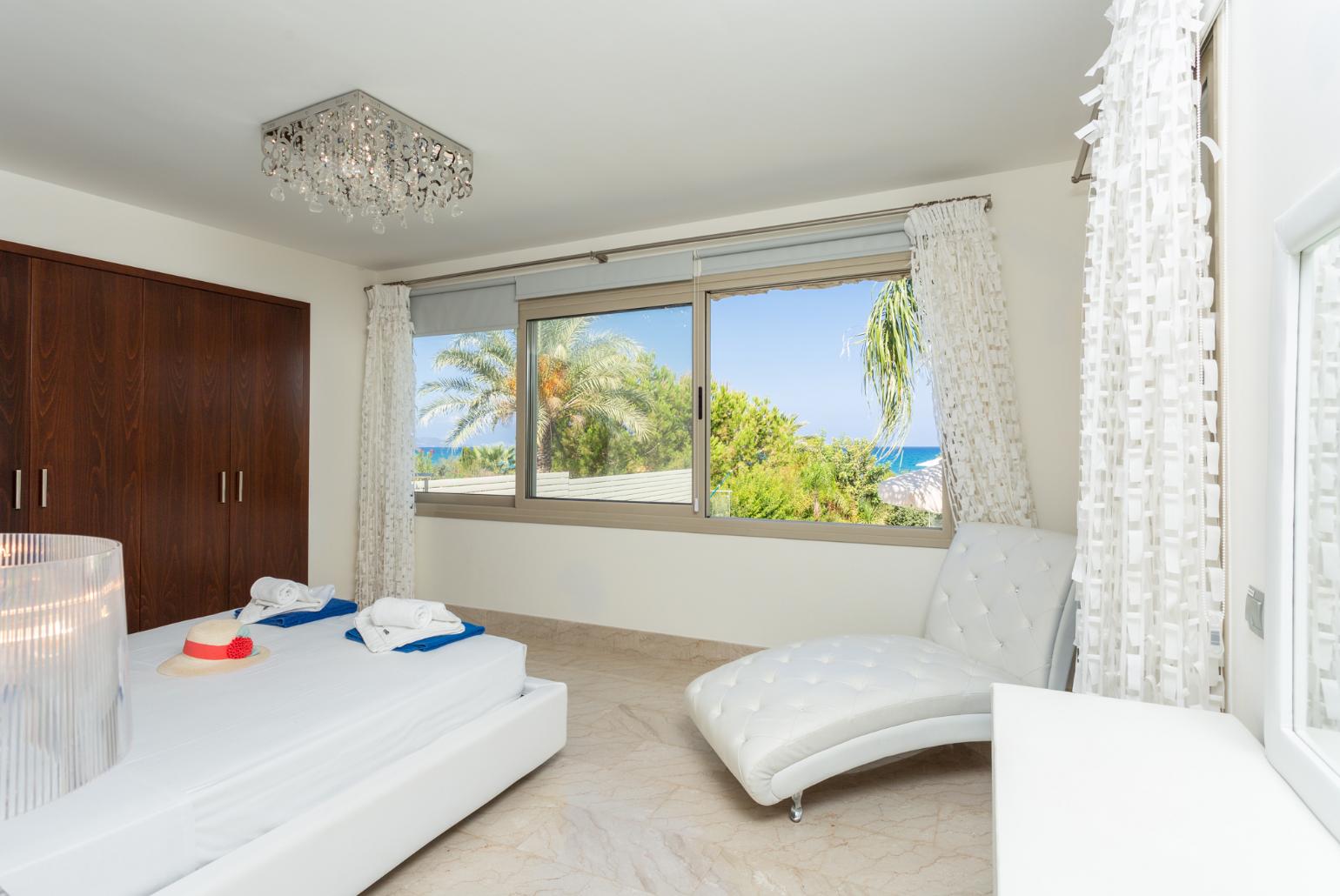 Double bedroom with en suite bathroom, A/C, and sea views