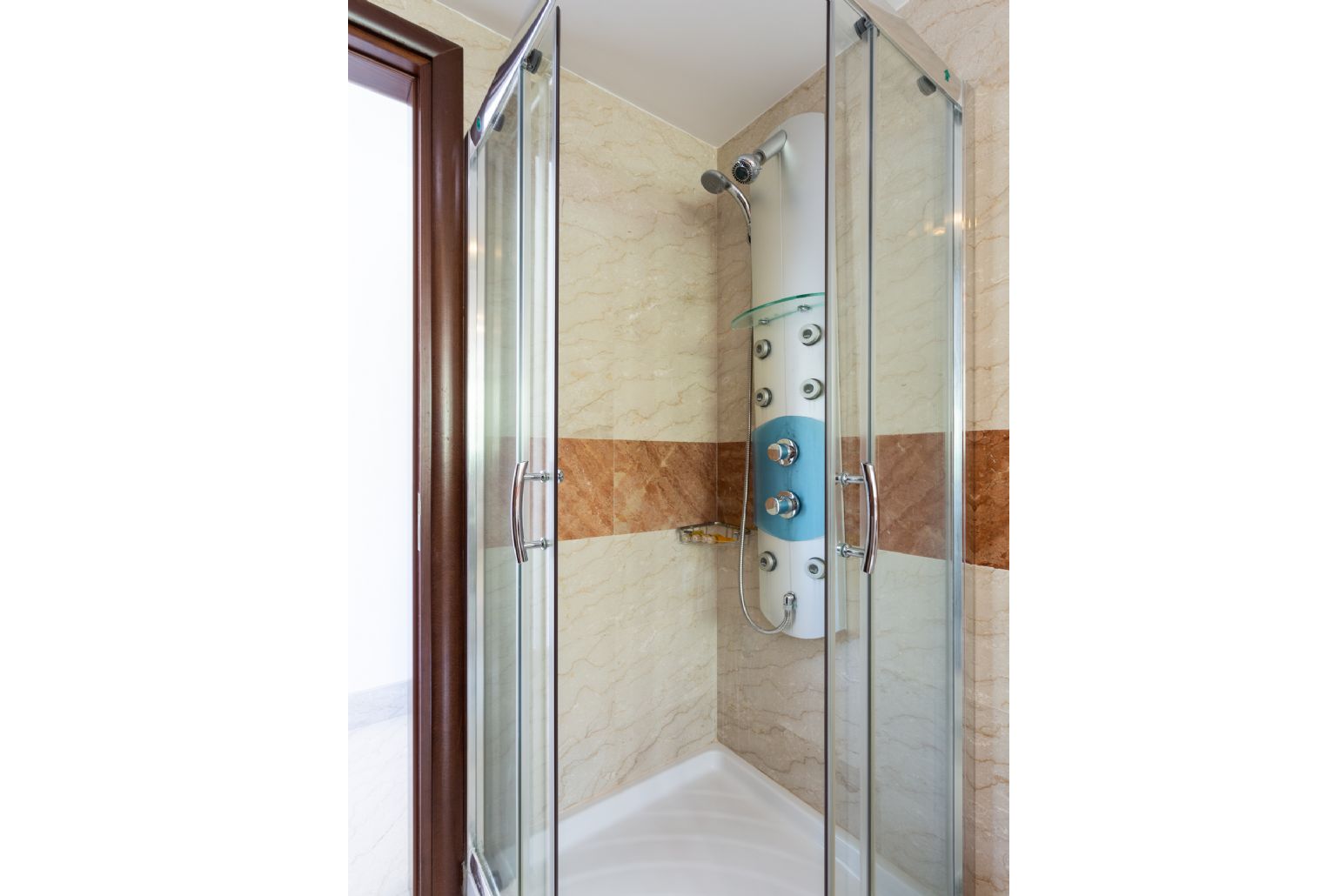 En suite bathroom with shower and spa bath