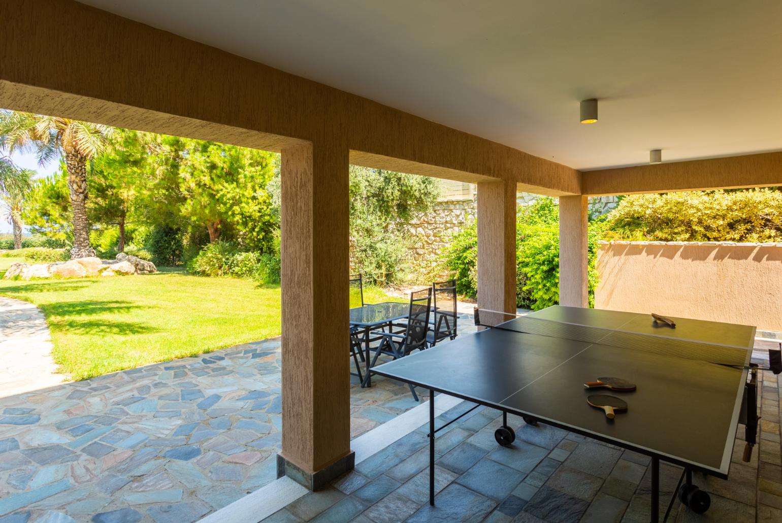 Sheltered terrace area with table tennis