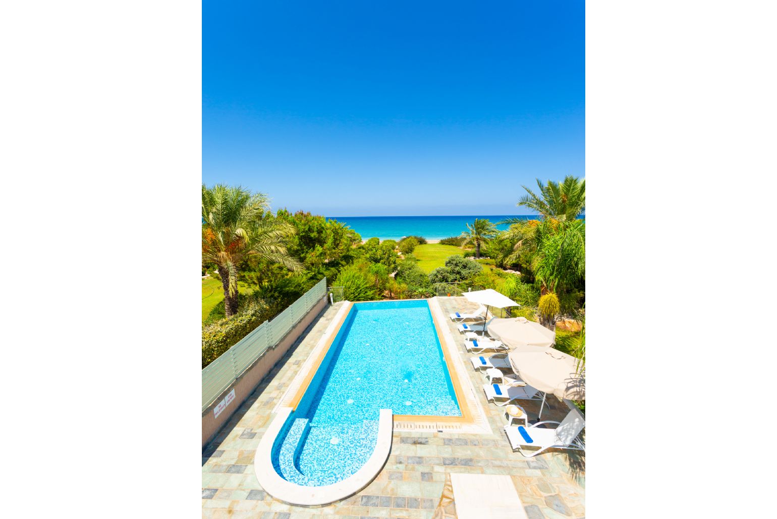 Private infinity pool, terrace, and garden with sea views