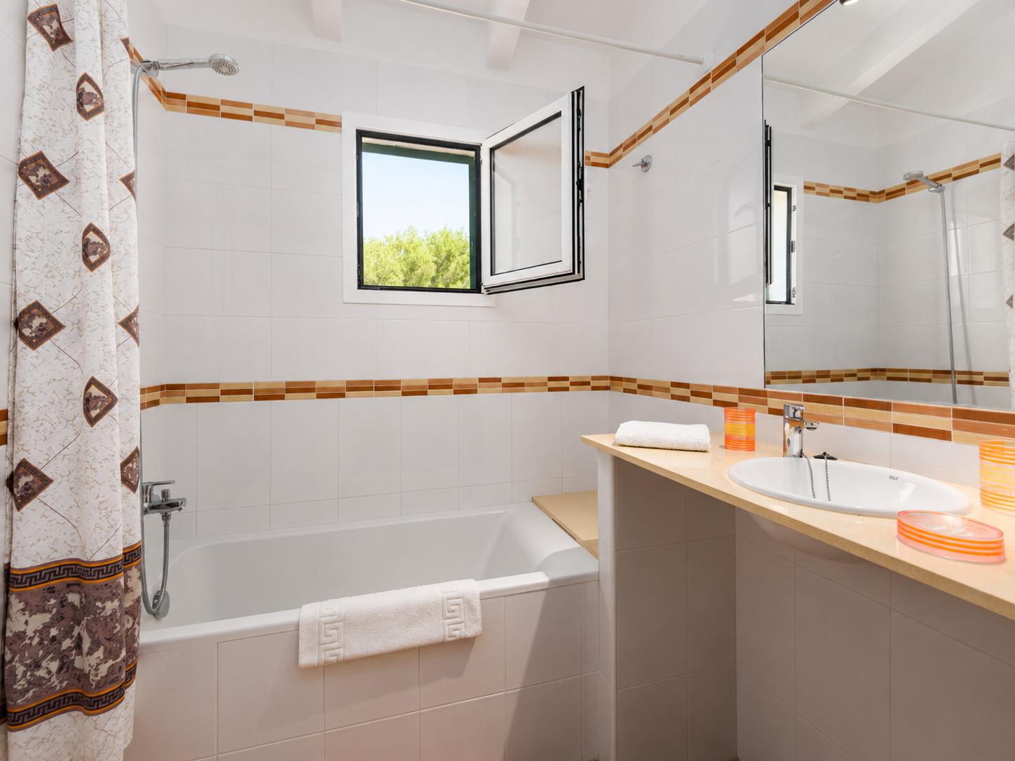 Family bathroom with bath and shower
