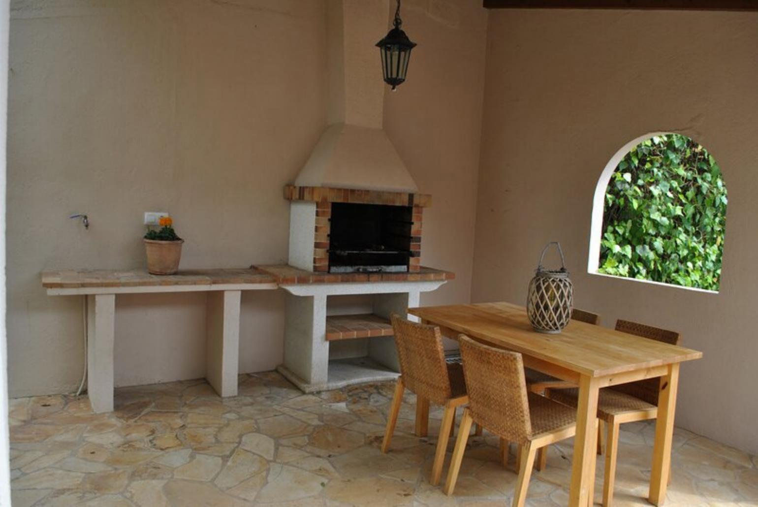 Sheltered terrace area with BBQ